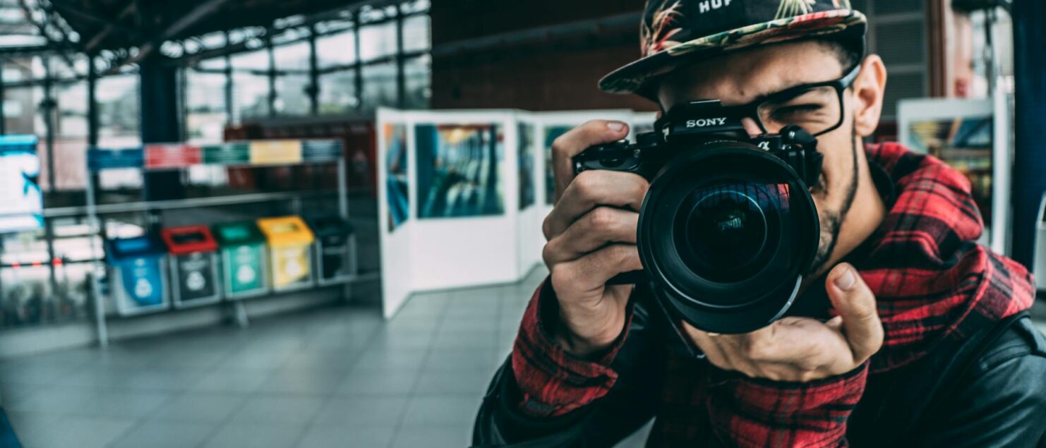 man holding dslr camera